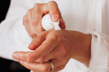 Person putting on hand cream