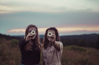 Two girls with flowers