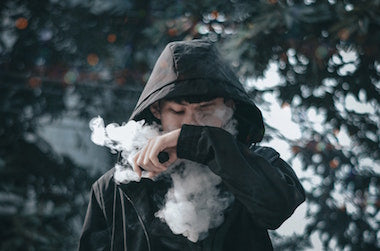 Boy in Hoodie Vaping