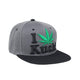 Cool snapback cap fashion item apparel with an I Love Kush wording beside weed leef pot design bold vibrant colors