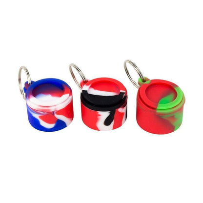 Pocket-friendly round silicone keychain wax container storage smoking accessory in swirling colors with small chain keyring